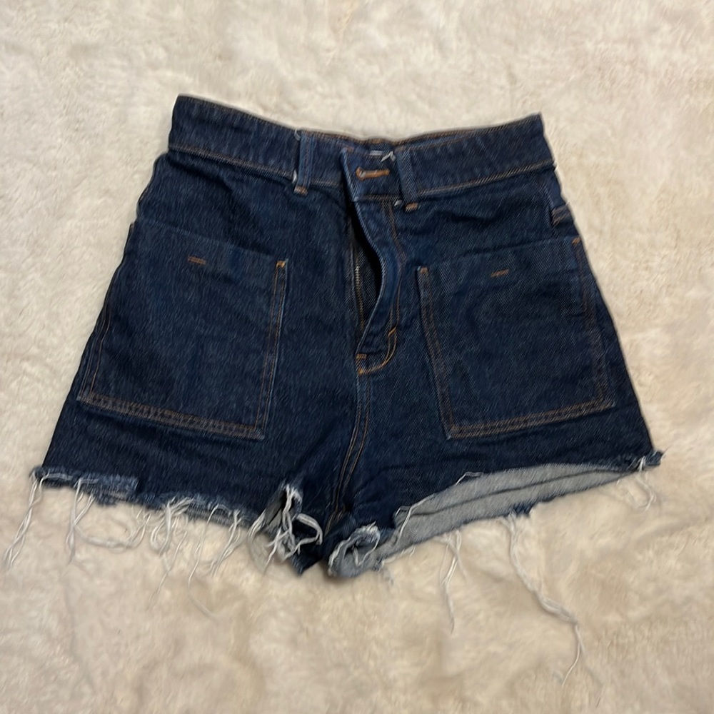 Zara denim shorts with large front pockets and button/ zipper closure.
